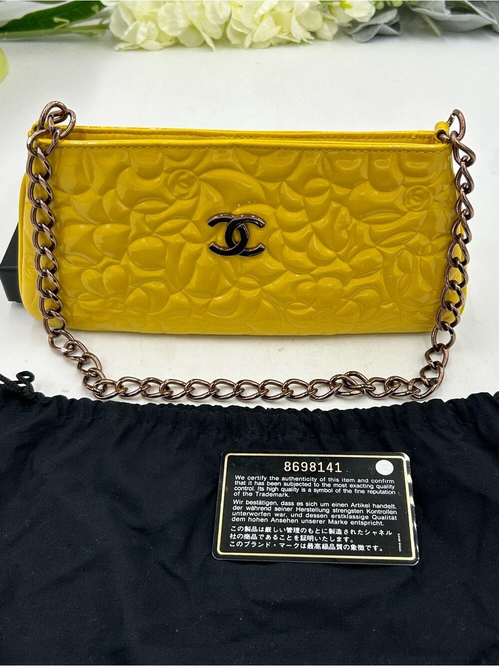 Women's Chanel patent leather floral embossed shoulder bag made in Italy